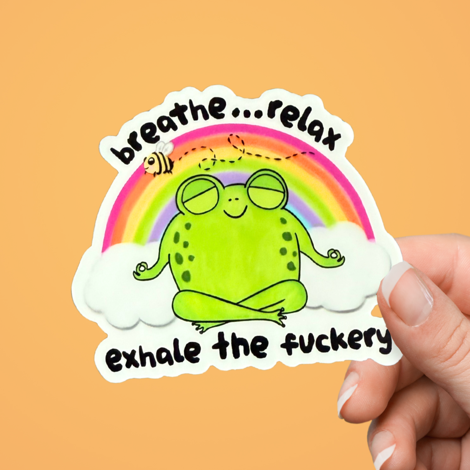 Sticker with a frog meditating, rainbow, and text on an orange background