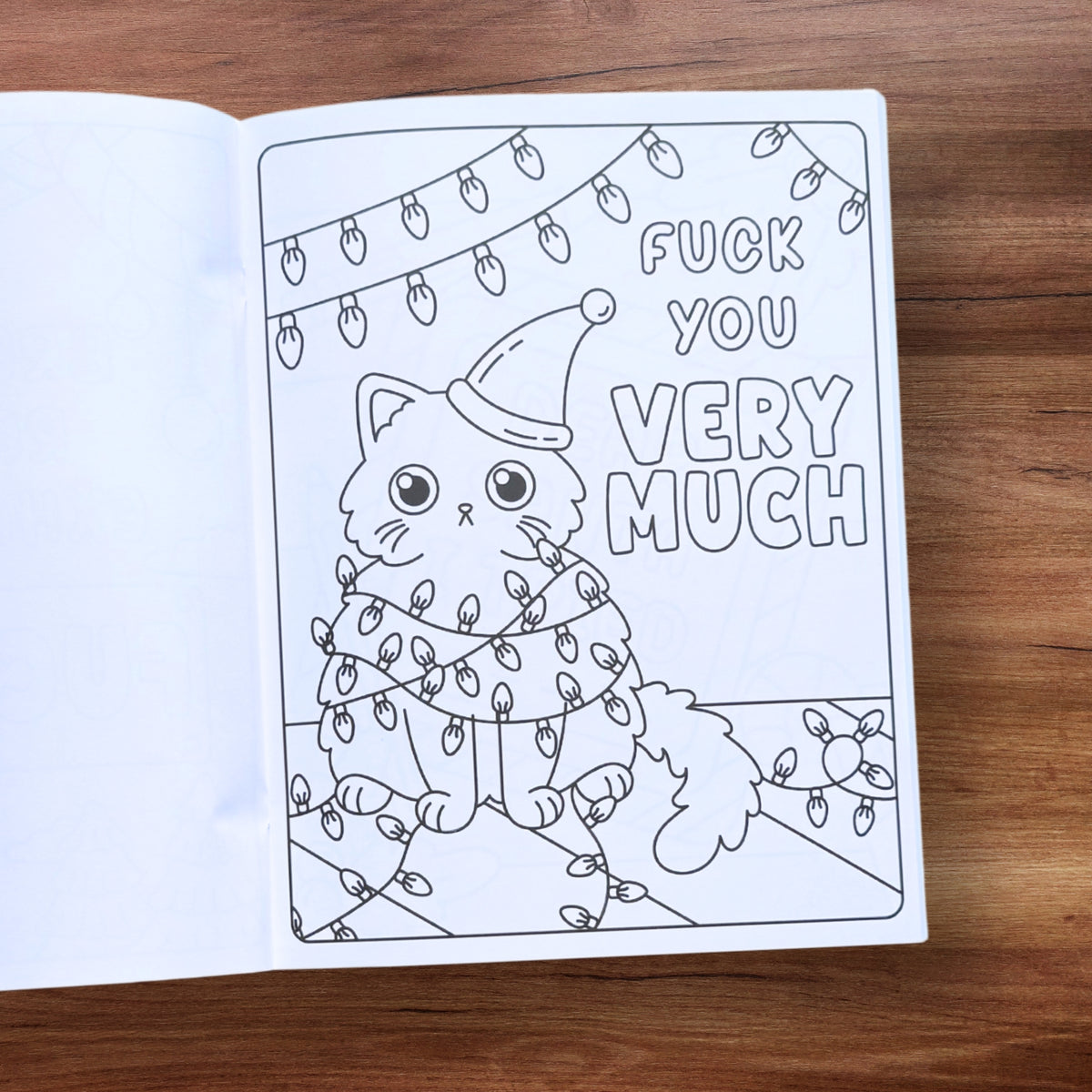 "F*ck You Very Much" coloring page with a cat in Christmas lights – Christmas swear word coloring book