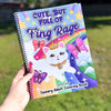 Hand holding Cute, But Full of F'ing Rage with a kitten and rainbow cover – sweary adult coloring book